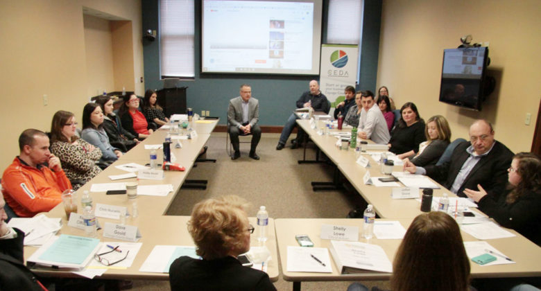 The Leadership Cayuga Class of 2018 attends a session on philanthropy with Dan Fessenden, center, Executive Director of the Fred L. Emerson Foundation, in the conference room at the Cayuga County Chamber of Commerce in Auburn.